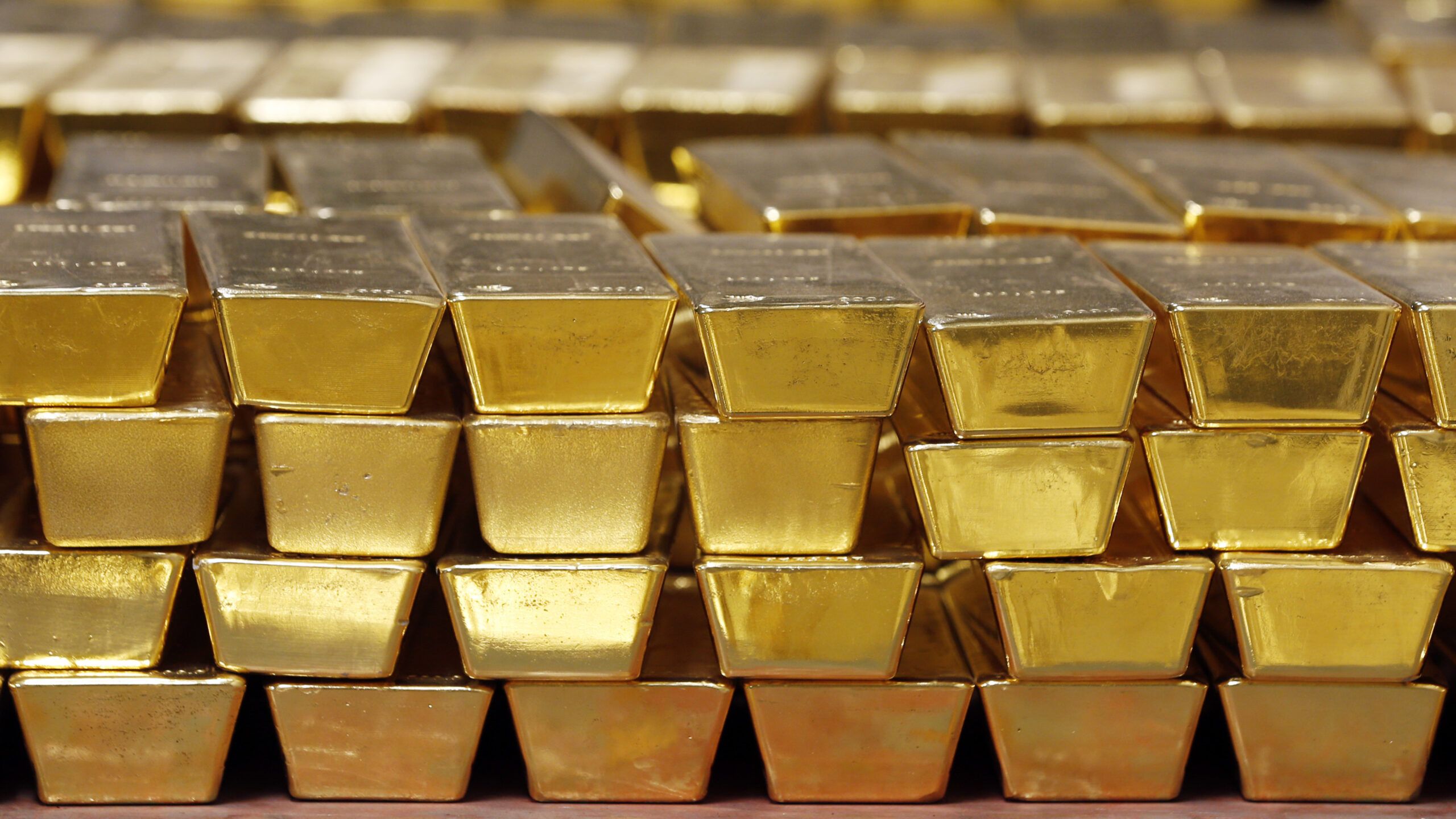 FILE - In this Tuesday, July 22, 2014, file photo, gold bars are stacked in a vault at the United States Mint, in West Point, N.Y. Over the last year the prices of metals have surged, and experts say they might stay high for a while. But getting in on those gains as an investor can be a challenge. (AP Photo/Mike Groll, File)