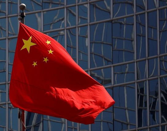 FILE PHOTO: The Chinese national flag is seen in Beijing, China April 29, 2020. REUTERS/Thomas Peter/File Photo/File Photo