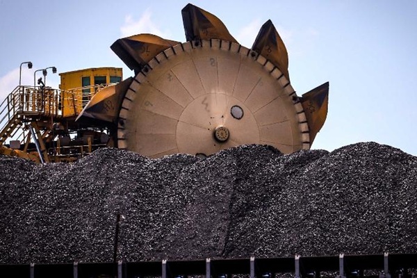 A bucket-wheel reclaimer stands next to a pile of coal at the Port of Newcastle in Newcastle, New South Wales, Australia, on Monday, Oct. 12, 2020. Prime Minister Scott Morrison??warned??last month that if power generators don't commit to building 1,000 megawatts of gas-fired generation capacity by April to replace a coal plant set to close in 2023, the pro fossil-fuel government would do so itself. Photographer: David Gray/Bloomberg via Getty Images
